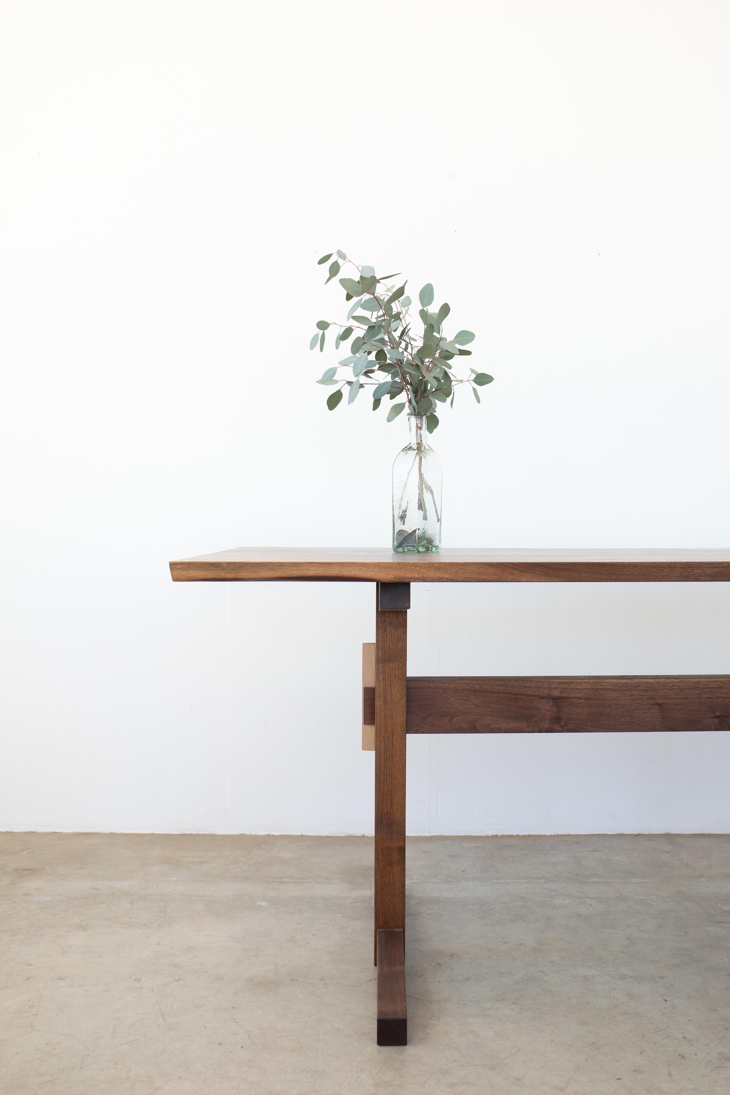 https://a.1stdibscdn.com/hana-walnut-trestle-dining-table-in-stock-for-sale-picture-2/f_49771/f_428426721734640547777/hana_trestle_1_master.jpg