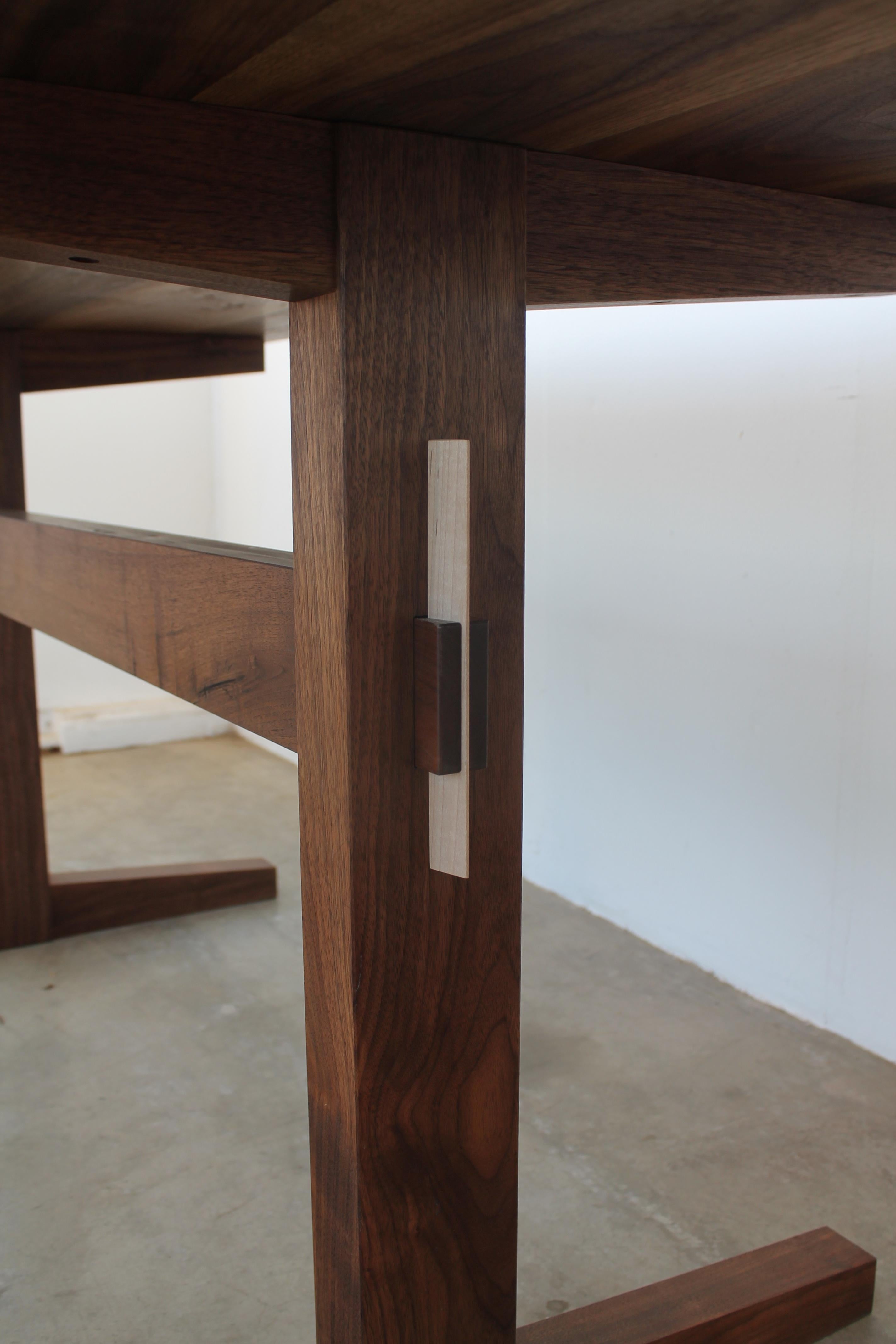 https://a.1stdibscdn.com/hana-walnut-trestle-dining-table-in-stock-for-sale-picture-5/f_49771/f_428426721734640550392/hana_trestle_5_master.jpg