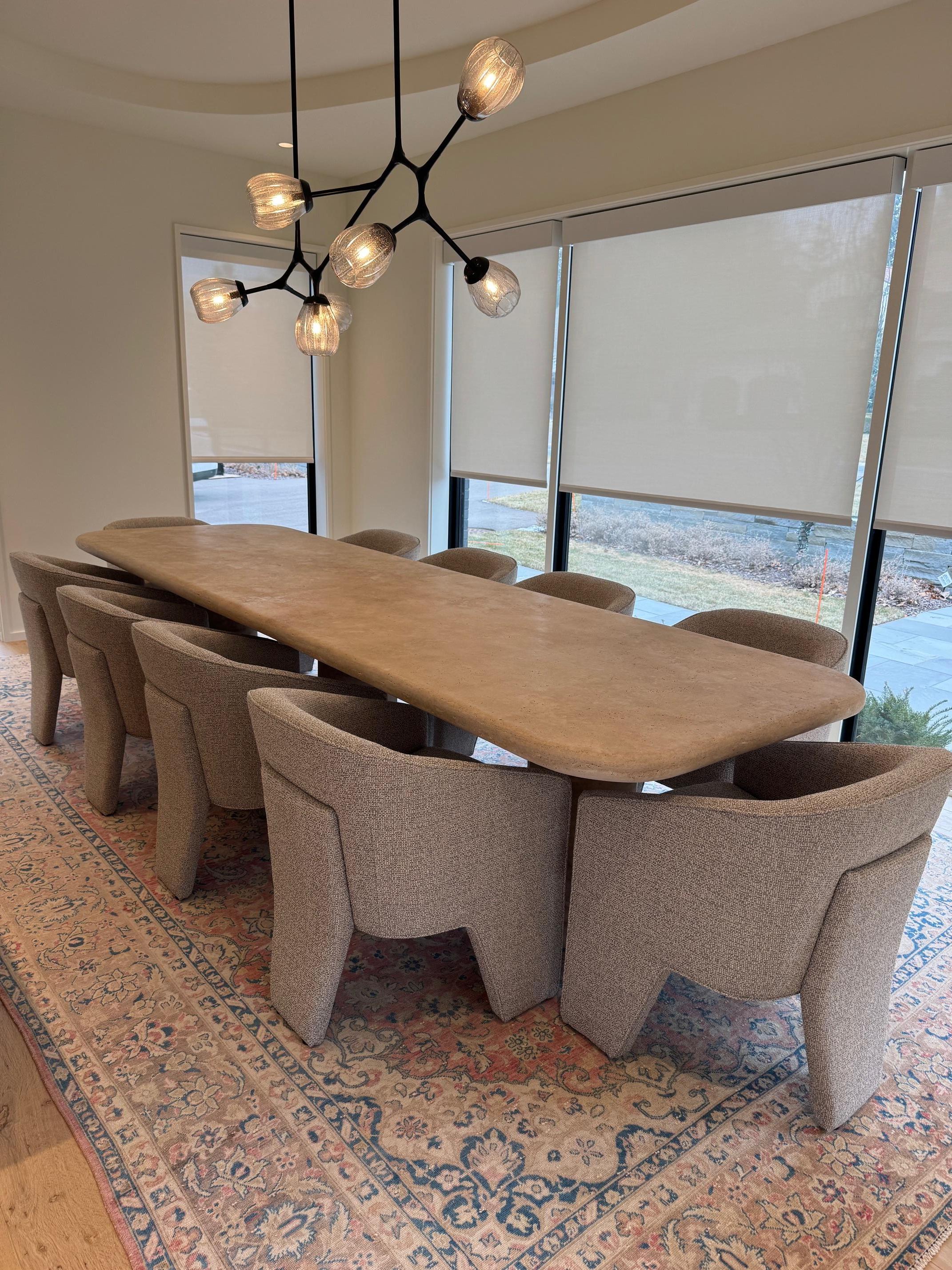 https://a.1stdibscdn.com/sculptural-large-travertine-dining-table-with-cylindrical-bases-and-curved-edges-for-sale-picture-2/f_80522/f_42414852/image2_1735042360769_master.jpeg