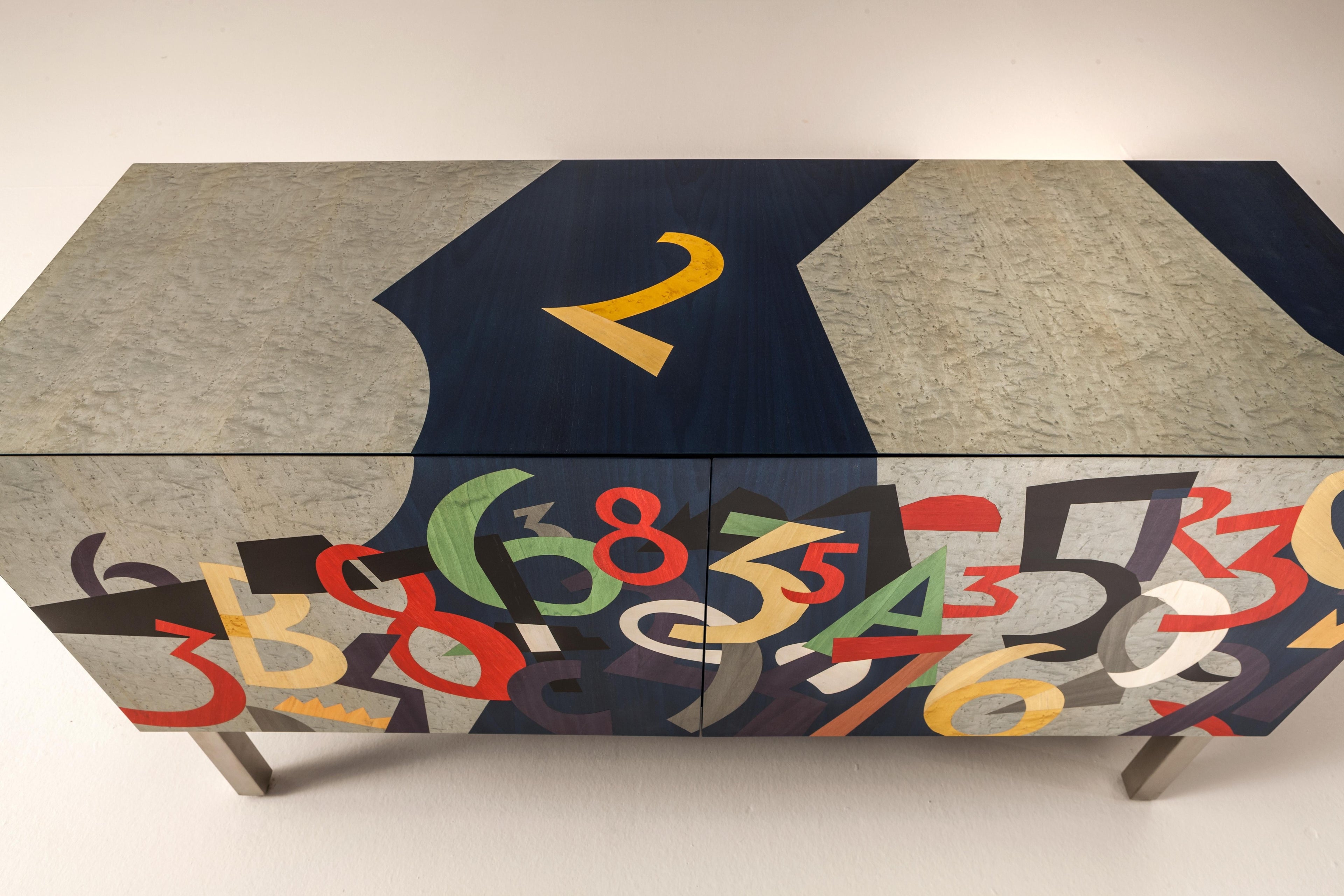 https://a.1stdibscdn.com/laurameroni-numeri-limited-edition-inlaid-sideboard-by-ugo-nespolo-for-sale-picture-5/f_52792/f_235458221619532110106/laurameroni_intarsia_numeri_ugo_nespolo_hd_04_master.jpg