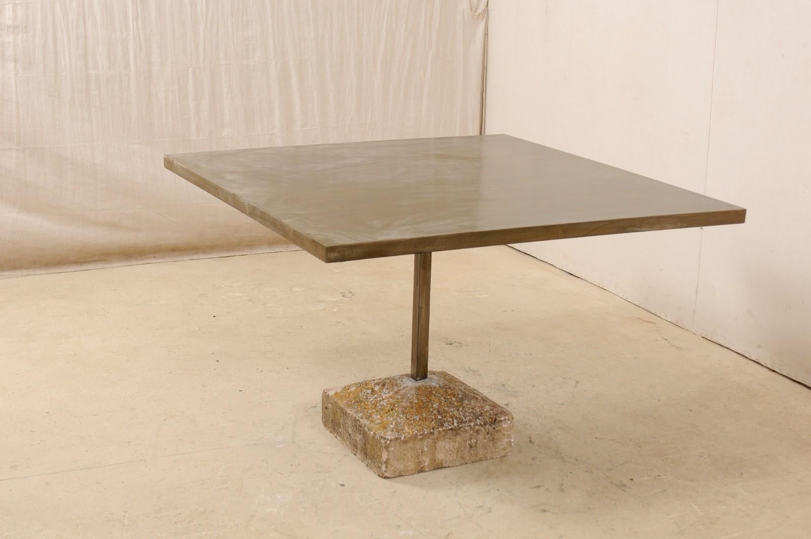 https://a.1stdibscdn.com/an-artisan-made-custom-4-ft-square-iron-top-table-on-stone-plinth-base-for-sale-picture-2/f_8764/1579552385425/lrgtable1568_1__master.jpg