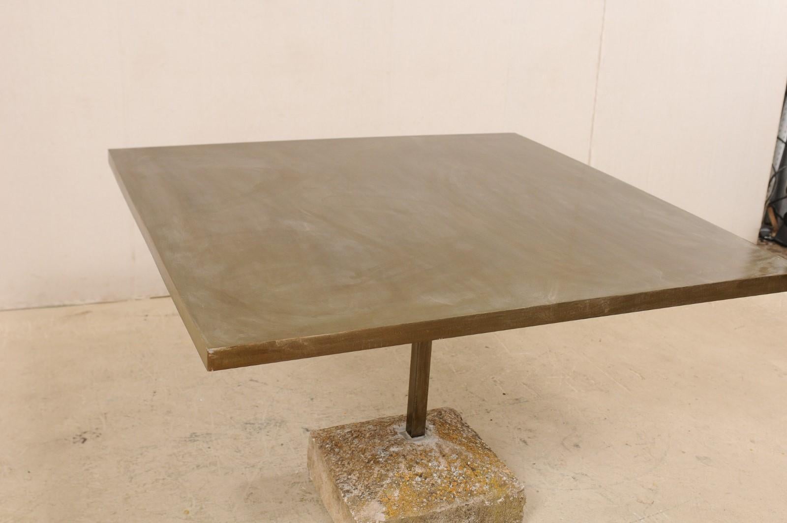 https://a.1stdibscdn.com/an-artisan-made-custom-4-ft-square-iron-top-table-on-stone-plinth-base-for-sale-picture-5/f_8764/1579552386013/lrgtable1568_3__master.jpg