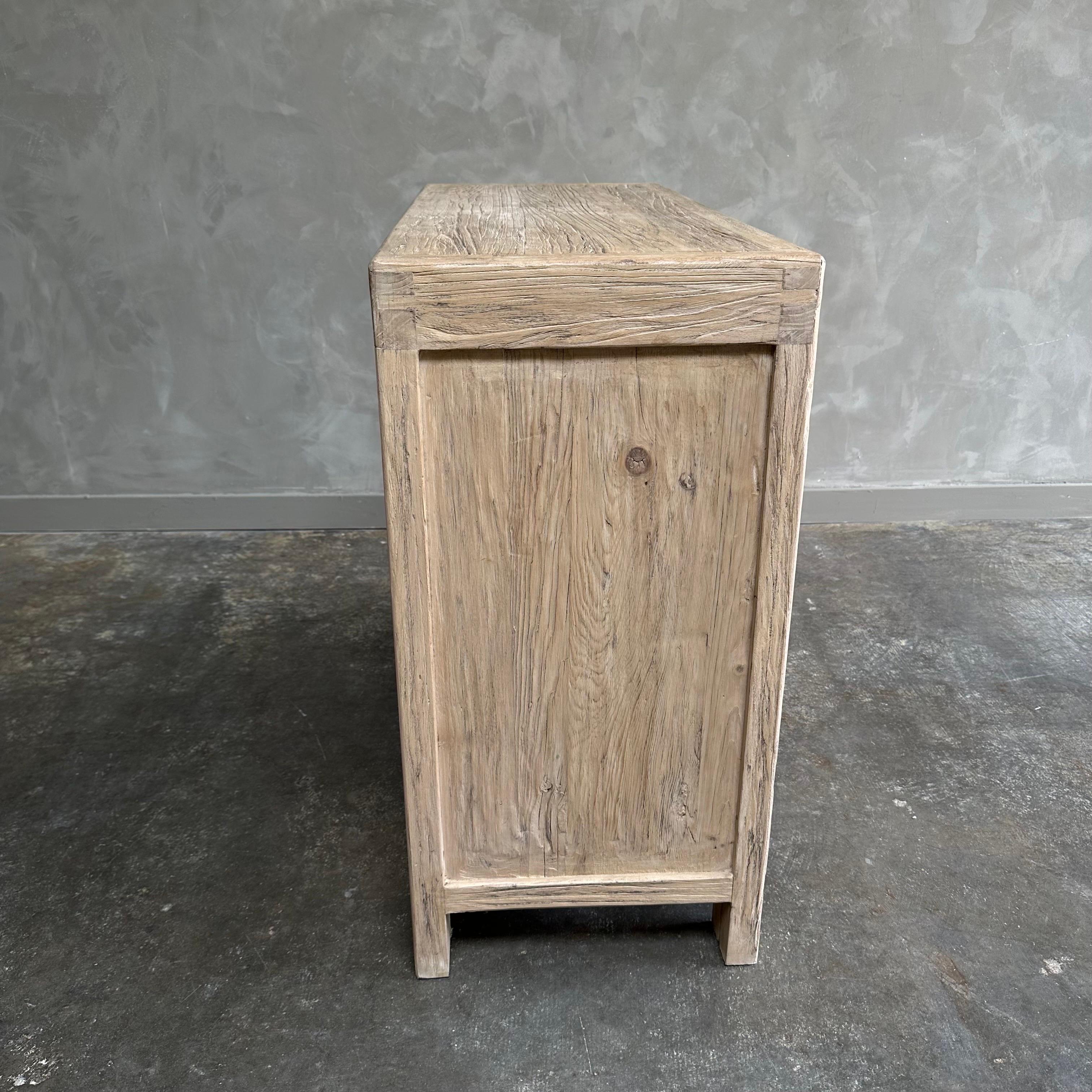 https://a.1stdibscdn.com/luna-reclaimed-elm-wood-cabinet-with-drawers-for-sale-picture-3/f_18223/f_469029521759438971121/mobilejpegupload_08DAC981F72649709904FA81D87830D8_master.jpg