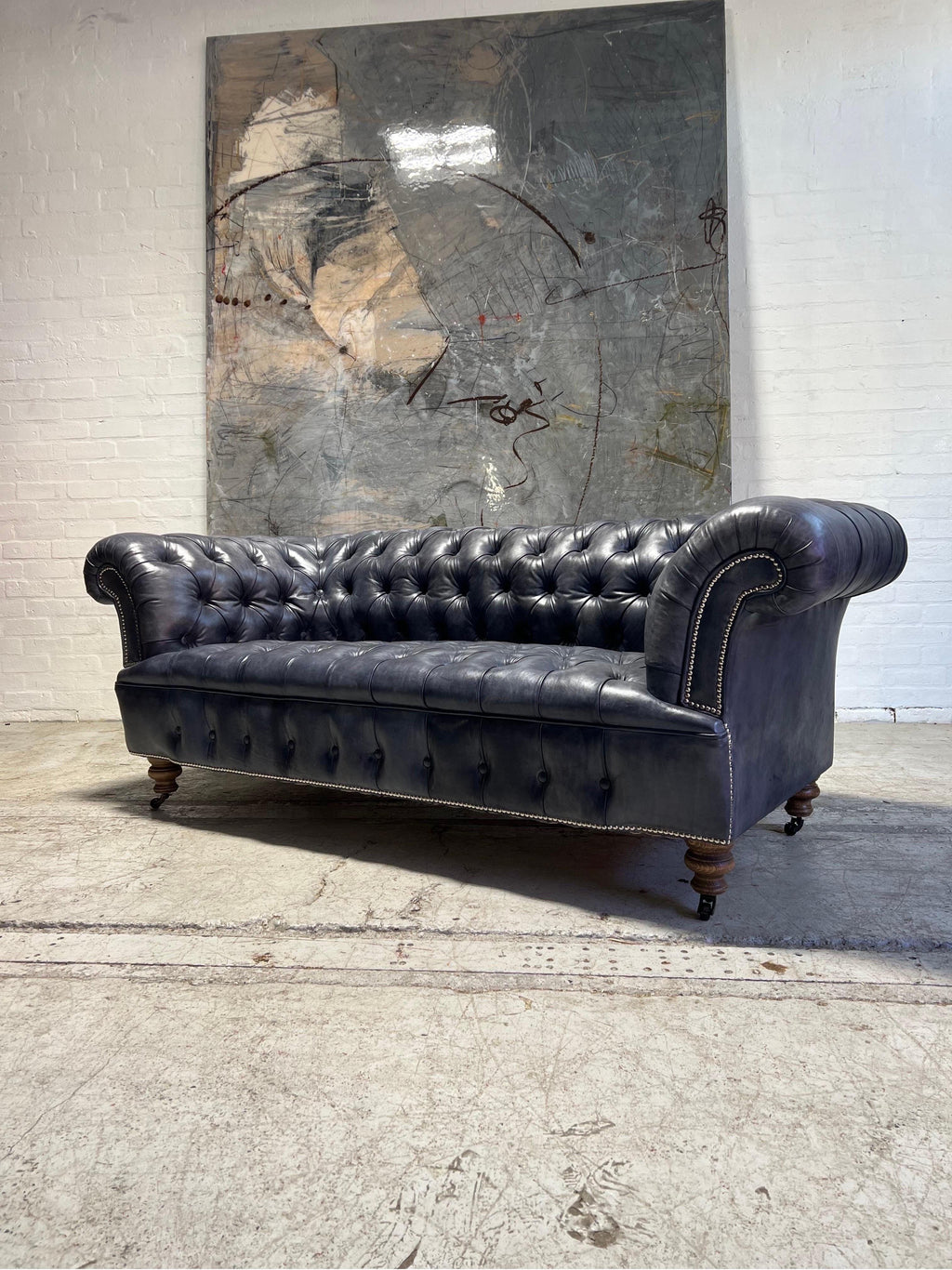 https://a.1stdibscdn.com/our-signature-howard-chesterfield-sofa-in-hand-dyed-elephant-grey-leather-for-sale-picture-11/f_79732/1677226991901/mobilejpegupload_21D89E9652A54E0DAADF85A73D61D771_master.jpg