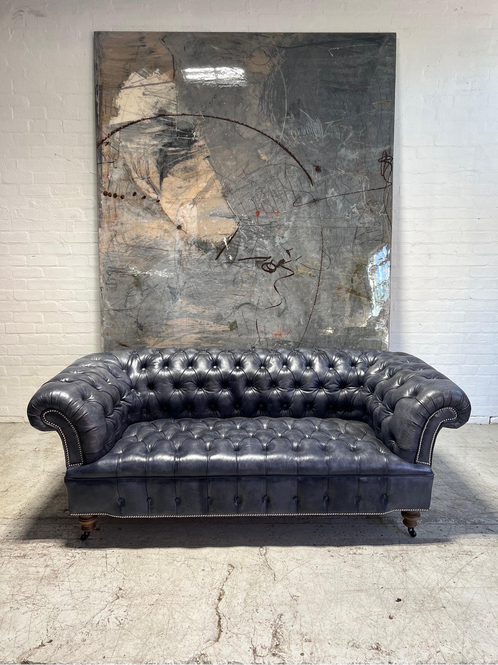https://a.1stdibscdn.com/our-signature-howard-chesterfield-sofa-in-hand-dyed-elephant-grey-leather-for-sale-picture-2/f_79732/1677226962057/mobilejpegupload_3C12D19287B2465CB1078E244FC70302_master.jpg
