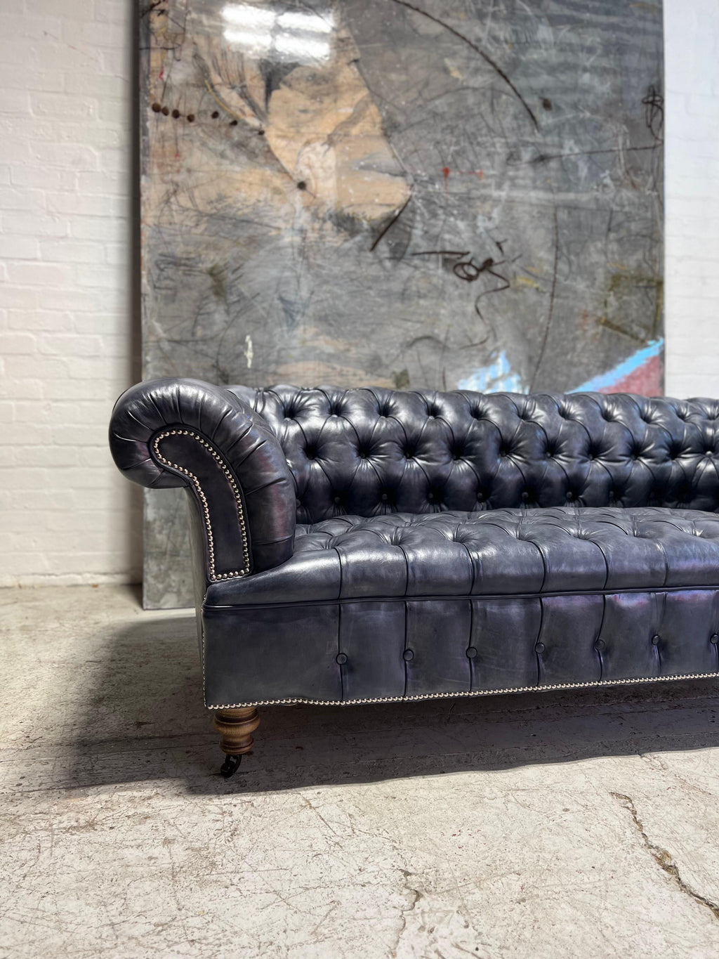 https://a.1stdibscdn.com/our-signature-howard-chesterfield-sofa-in-hand-dyed-elephant-grey-leather-for-sale-picture-4/f_79732/1677225858916/mobilejpegupload_7575962969124ADCAB41365F266A1C68_master.jpg