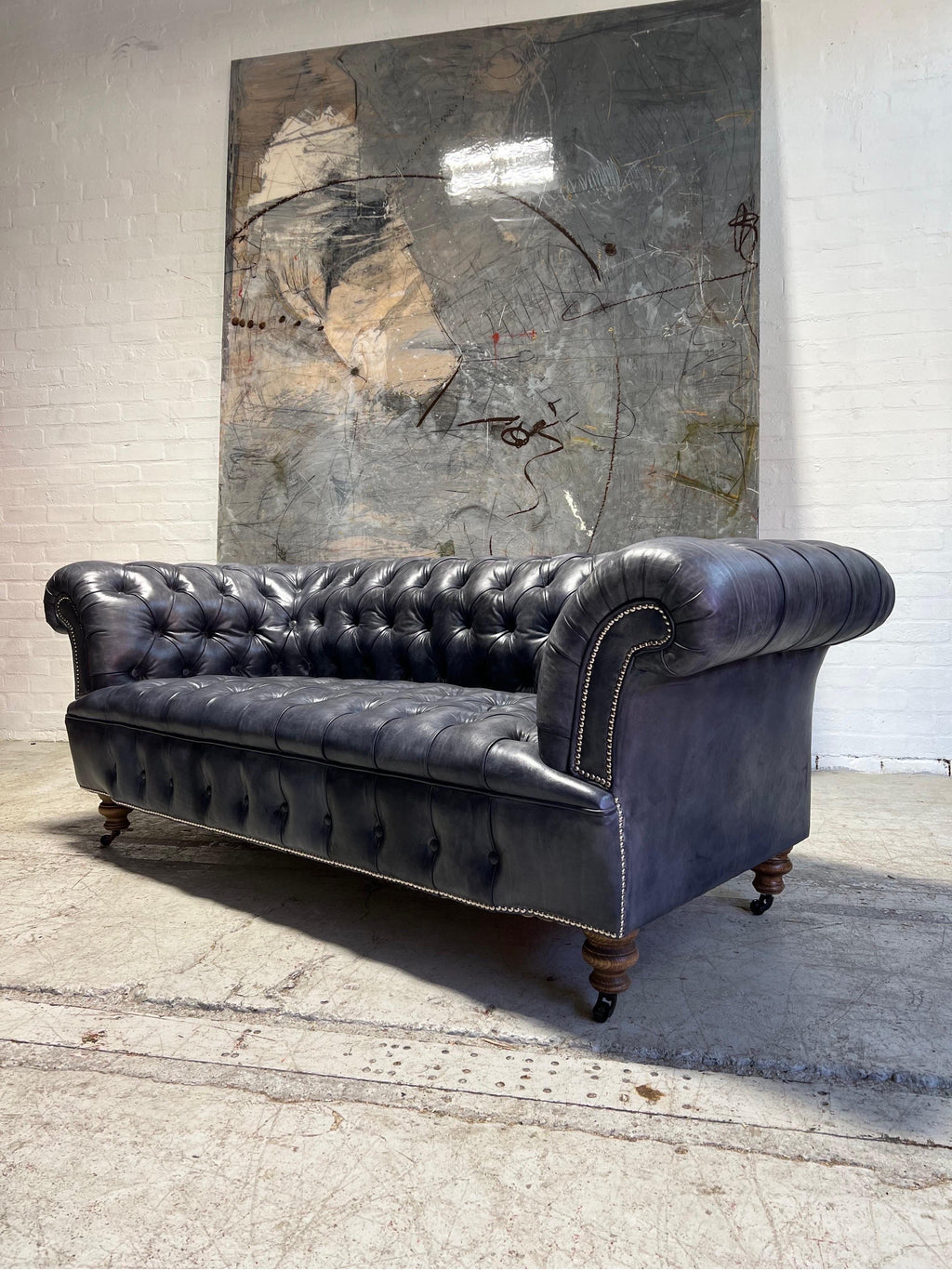 https://a.1stdibscdn.com/our-signature-howard-chesterfield-sofa-in-hand-dyed-elephant-grey-leather-for-sale-picture-10/f_79732/1677226986445/mobilejpegupload_B342A93233EC4C59BFC5015C61C8A6EE_master.jpg