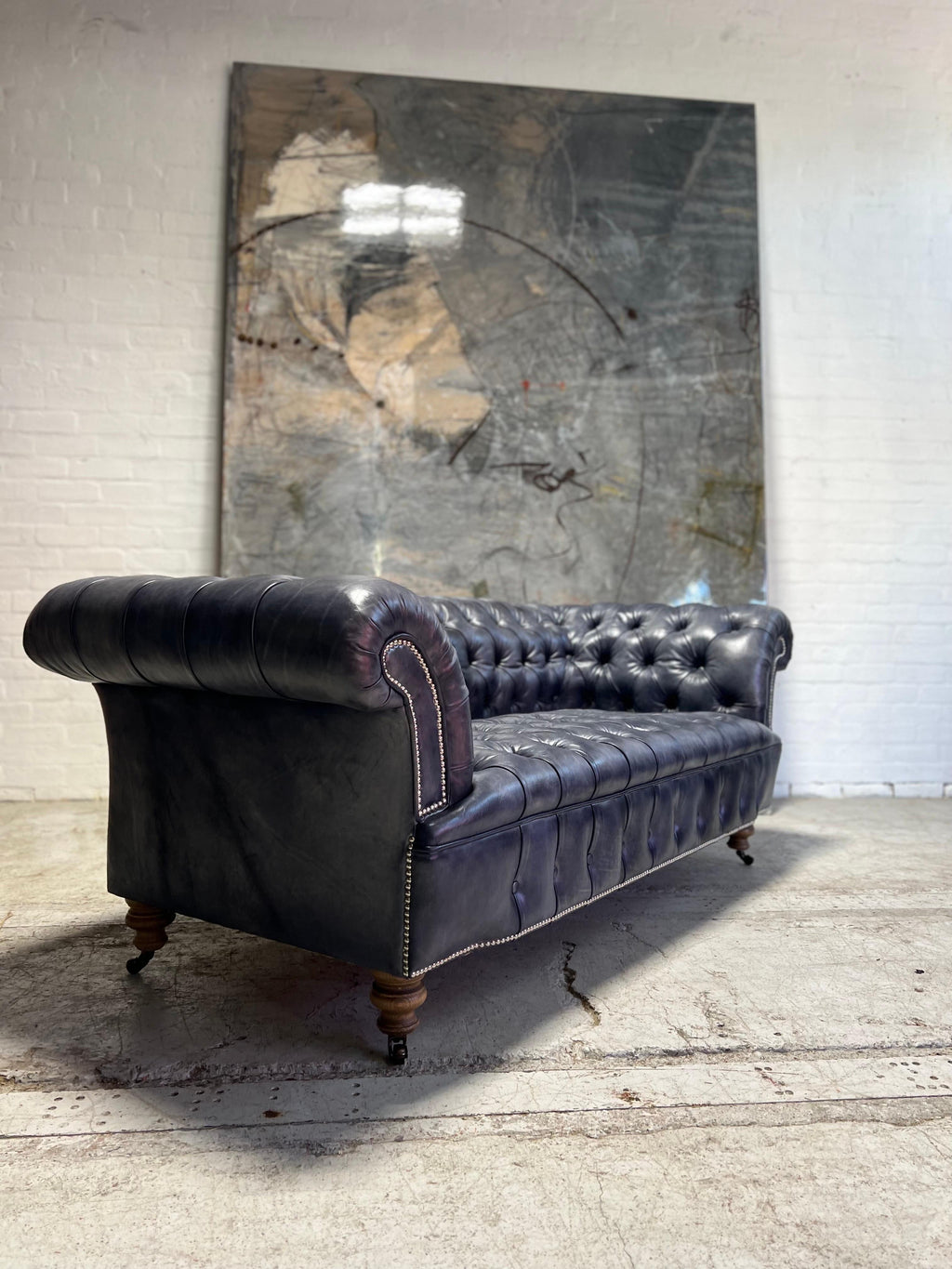 https://a.1stdibscdn.com/our-signature-howard-chesterfield-sofa-in-hand-dyed-elephant-grey-leather-for-sale-picture-7/f_79732/1677225866249/mobilejpegupload_DD02BCF5C6F04F9E82C178FEFBB2EDB2_master.jpg