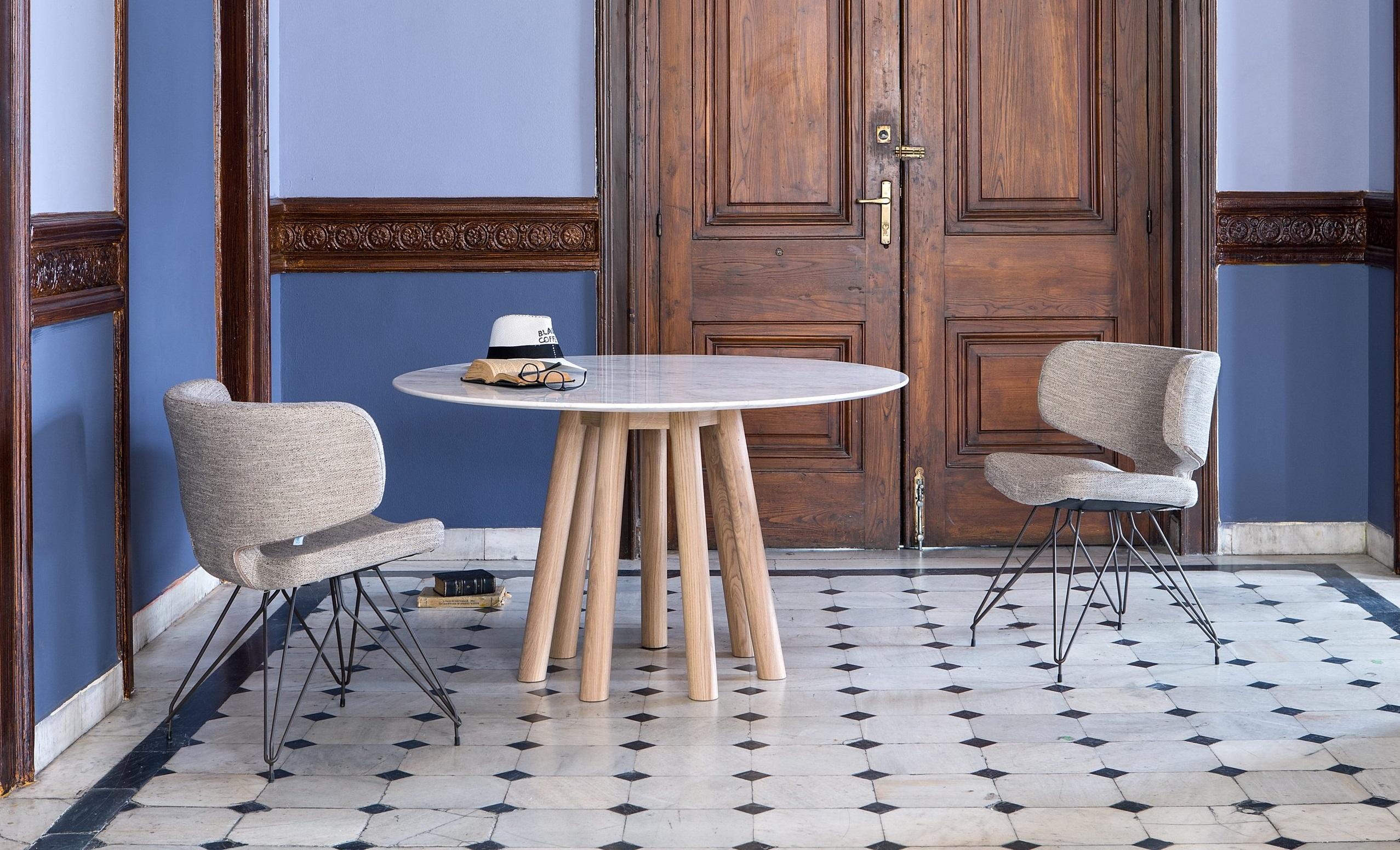 https://a.1stdibscdn.com/contemporary-round-table-featuring-7-legs-in-american-walnut-for-sale-picture-4/f_27693/f_237238421620682662703/mos_i_ko_001_RAM_omicra_010_ambient_1_scaled_master.jpg