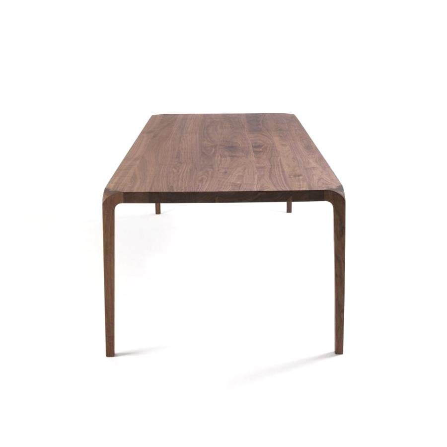 https://a.1stdibscdn.com/sleek-wood-dining-table-designed-by-karim-rashid-made-in-italy-for-sale-picture-2/f_49571/f_188230521587679470459/sleek_1_master.jpg