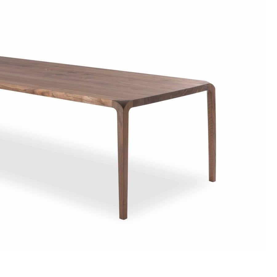 https://a.1stdibscdn.com/sleek-wood-dining-table-designed-by-karim-rashid-made-in-italy-for-sale-picture-3/f_49571/f_188230521587679469842/sleek_2_master.jpg