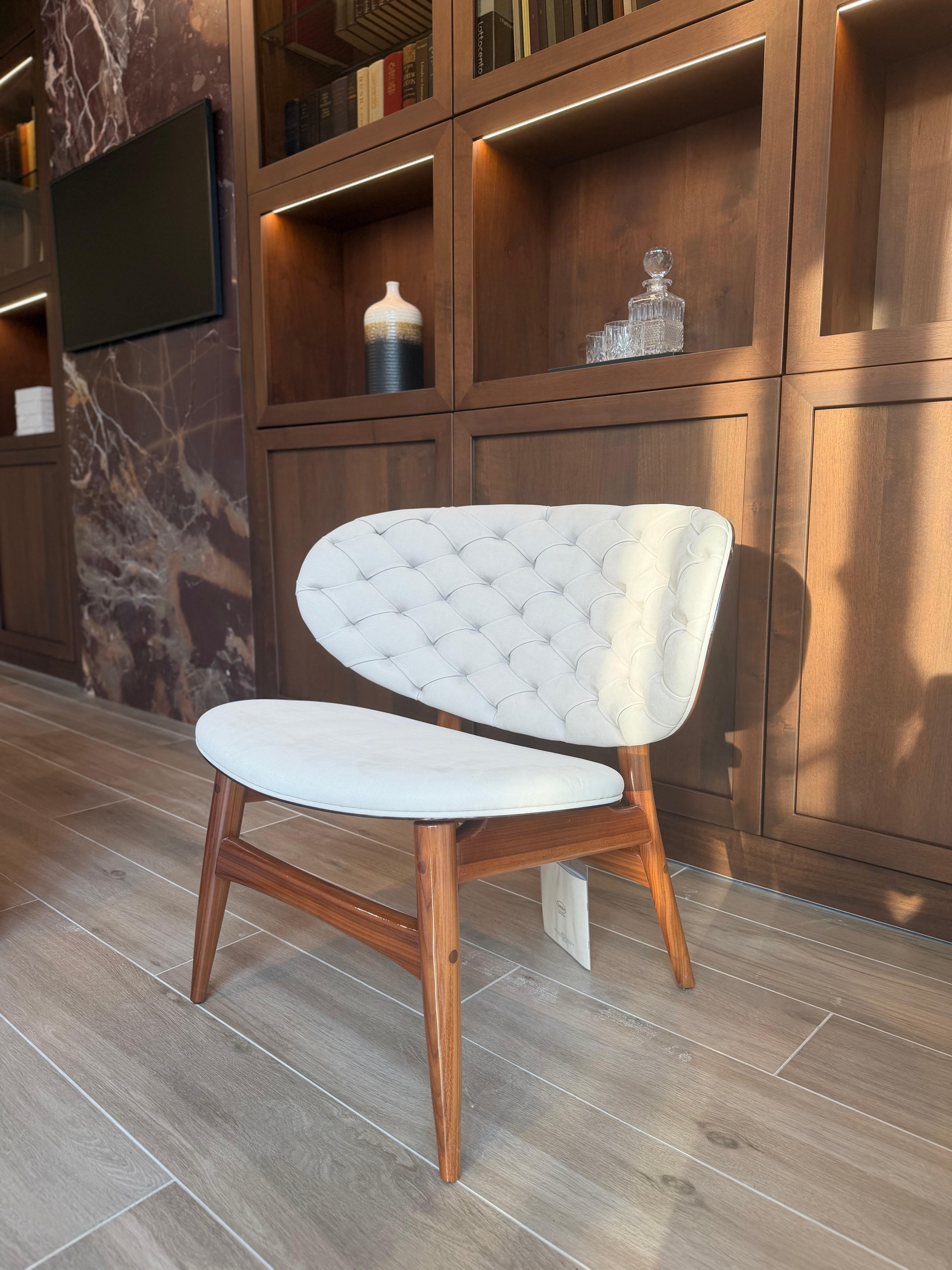 https://a.1stdibscdn.com/baxter-dalma-armchair-by-draga-aurel-tufted-leather-wood-for-sale-picture-3/f_108682/f_494480021774996228356/tempImagew4q3Gw_master.jpg