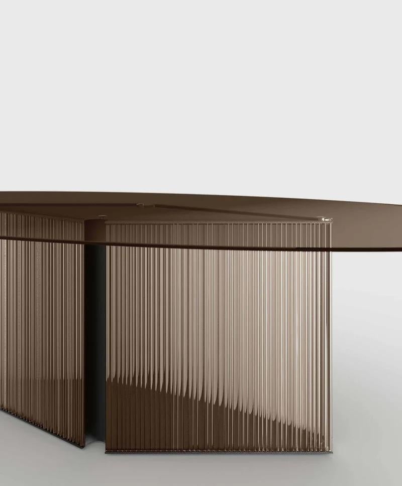 https://a.1stdibscdn.com/bow-bronze-oval-glass-dining-table-with-fused-glass-base-made-in-italy-for-sale-picture-3/f_77512/f_490227221772256105648/tonelli_design_dining_table_bow_bronze_t_stripes_master.jpg