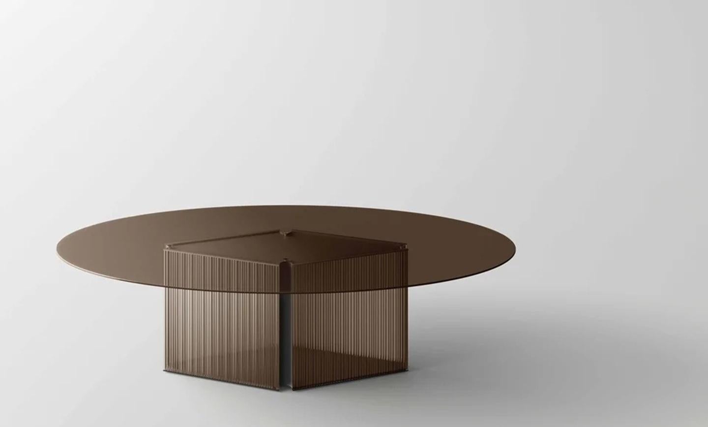 https://a.1stdibscdn.com/bow-bronze-oval-glass-dining-table-with-fused-glass-base-made-in-italy-for-sale-picture-2/f_77512/f_490227221772300579086/tonelli_design_dining_table_bronze_with_t_Stripes_base_master.jpg