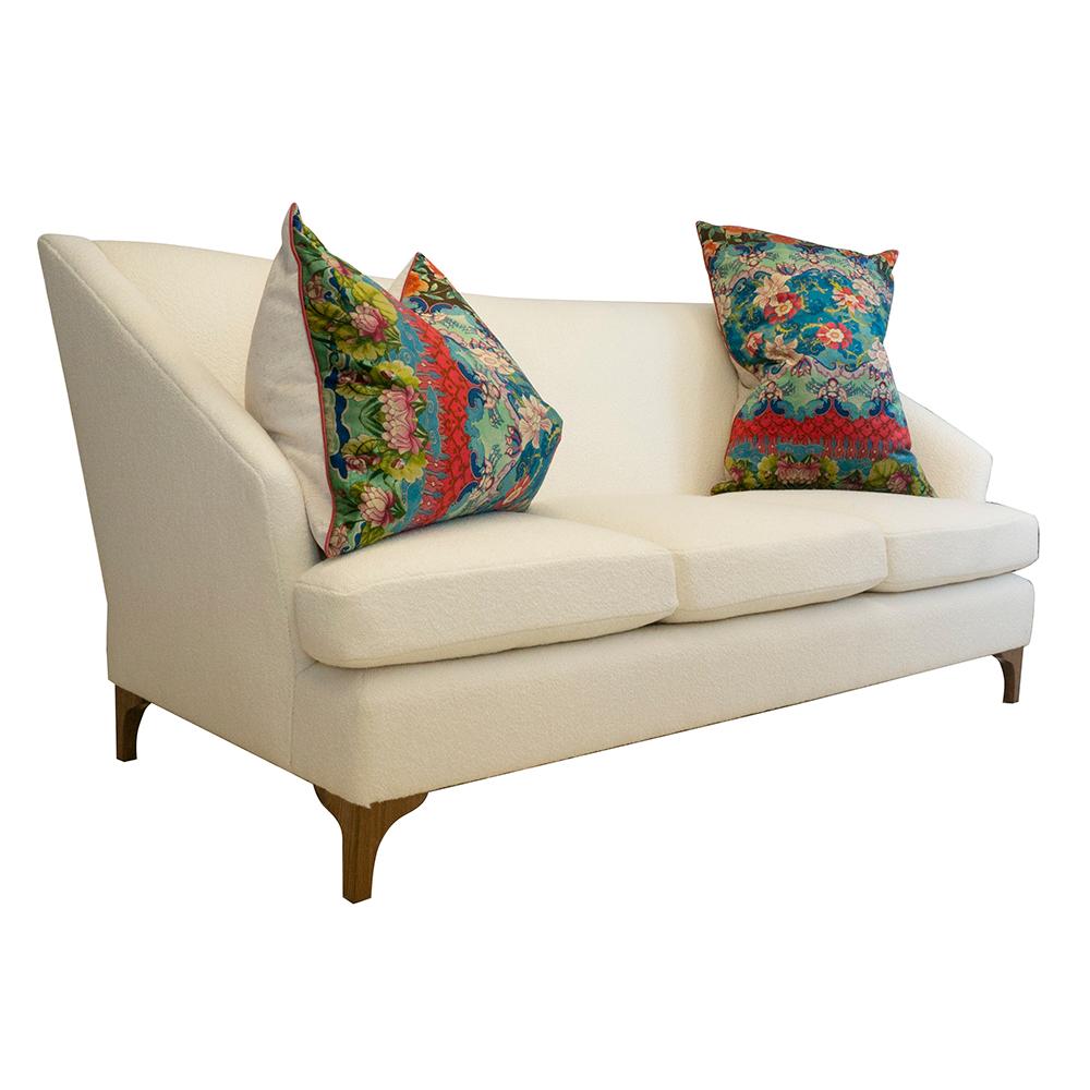 https://a.1stdibscdn.com/tall-back-tight-back-winged-sofa-with-walnut-legs-and-wool-boucle-fabric-for-sale-picture-4/f_21233/1539637327428/whitesofa_anglewithpillows_master.jpg