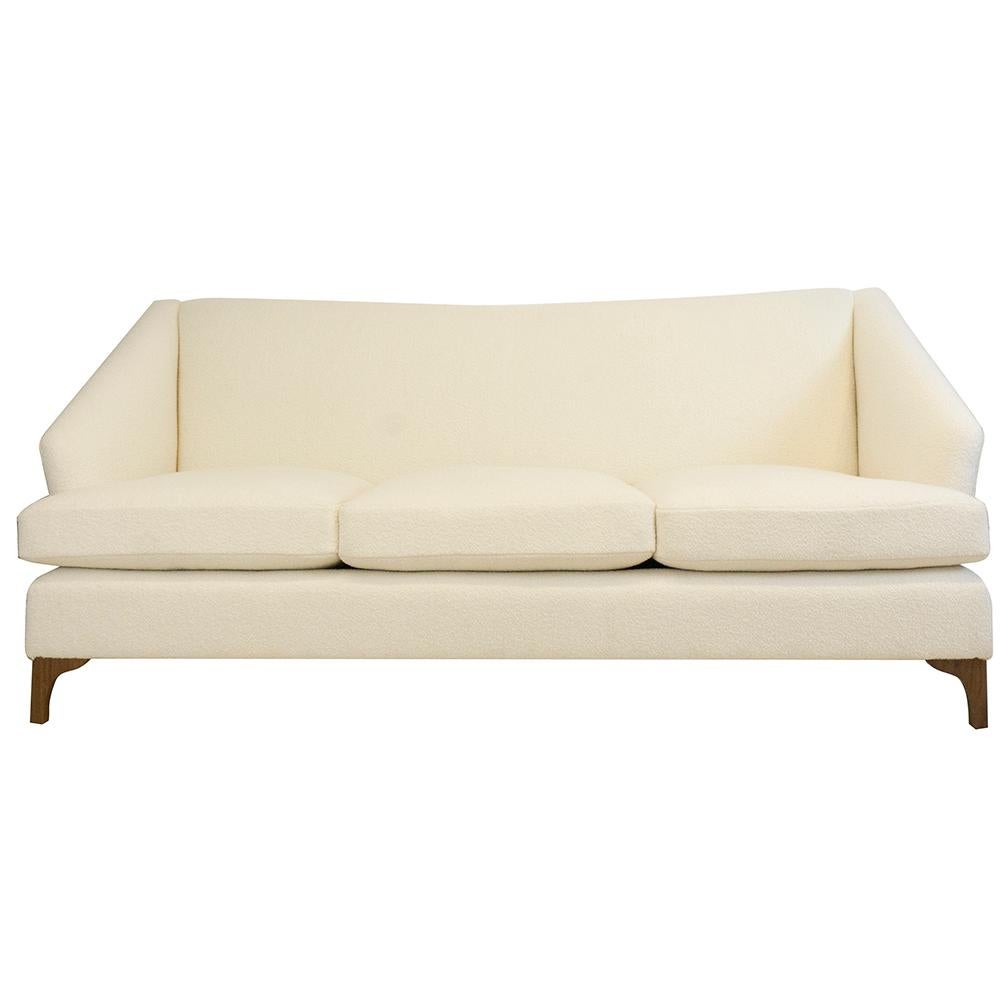 https://a.1stdibscdn.com/tall-back-tight-back-winged-sofa-with-walnut-legs-and-wool-boucle-fabric-for-sale/f_21233/1539637328170/whitesofa_front_master.jpg