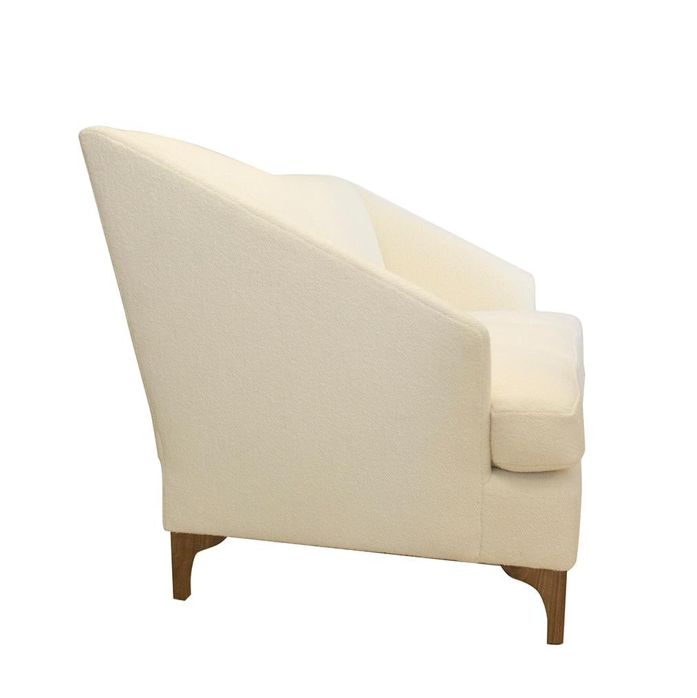 https://a.1stdibscdn.com/tall-back-tight-back-winged-sofa-with-walnut-legs-and-wool-boucle-fabric-for-sale-picture-3/f_21233/1539637330829/whitesofa_side_master.jpg