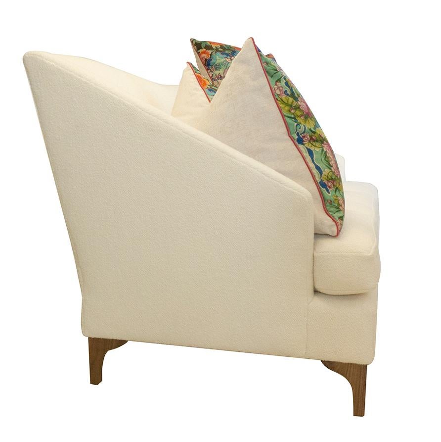 https://a.1stdibscdn.com/tall-back-tight-back-winged-sofa-with-walnut-legs-and-wool-boucle-fabric-for-sale-picture-7/f_21233/1539637331837/whitesofa_sidewithpillows_master.jpg