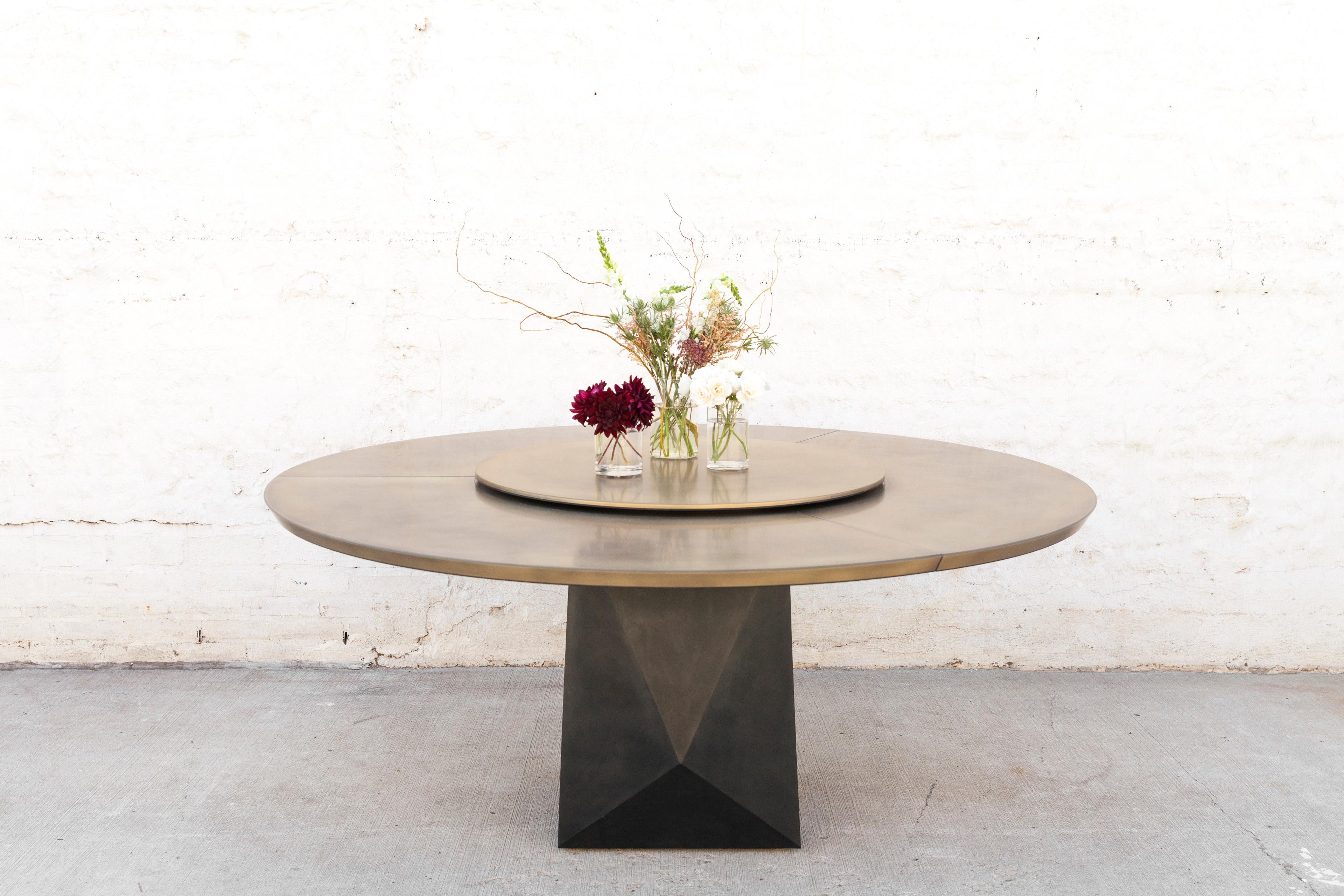 https://a.1stdibscdn.com/prism-dining-table-customizable-metal-and-resin-for-sale-picture-4/f_22133/f_132763021547138161929/wud_furniture_bronze_crazy_susan_steel_polygonal_base_0008_master.jpg
